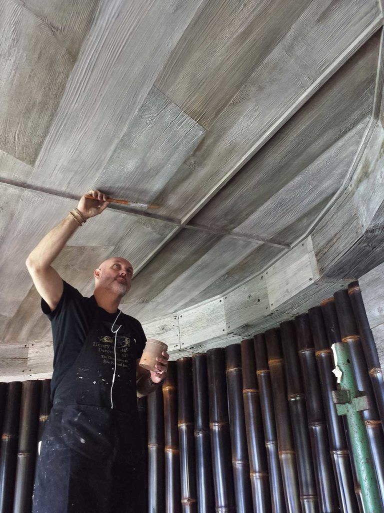 Richard on the Seychelles faux aged wood ceilings.