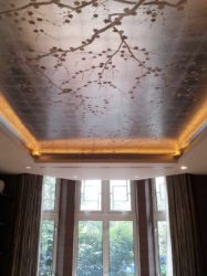 Trompe l'oeil ceiling mural of oriental spring blossom on antiqued metal leaf - London