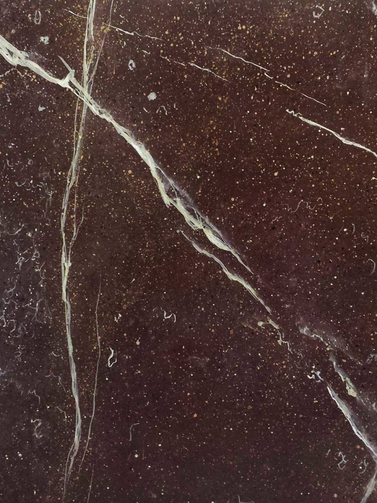 Hand painted faux Porphyry stone ref Nina Campbell's new wallpaper collection.