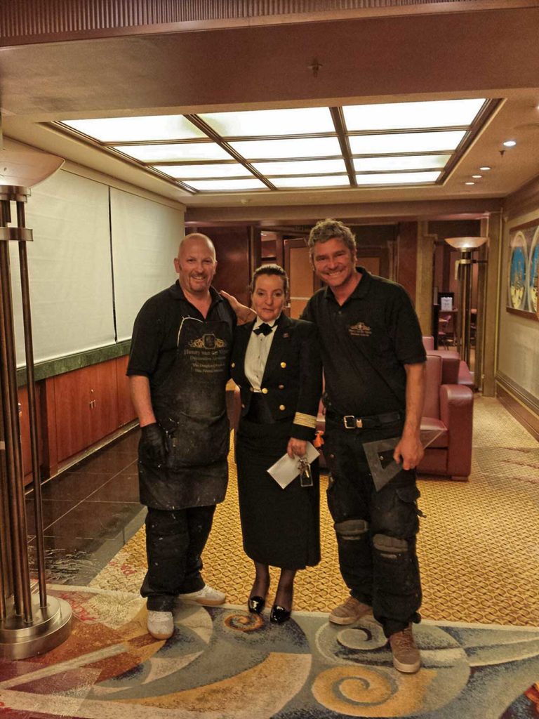 Restoration works on faux bronze finishes on board the QM2 cruising to New York.